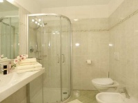 Ã¢ÂÂ¢bathroom with shower, toilet, bidet and hair-dryer 